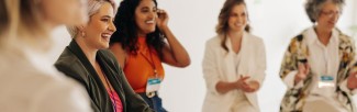Women in a circle laughing