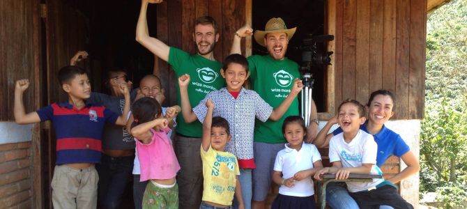 Wize Monkey co-founders Arnaud Petitvallet (left) and Max Rivest (right) are shown with the children of coffee growers in Matagalpa, Nicaragua. 