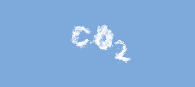 The elemental code for carbon dioxide, CO2, is spelled out with clouds in a blue sky